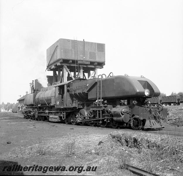 P06103
ASG class 29 Garratt, water tower, Collie loco depot, side and end view, being watered
