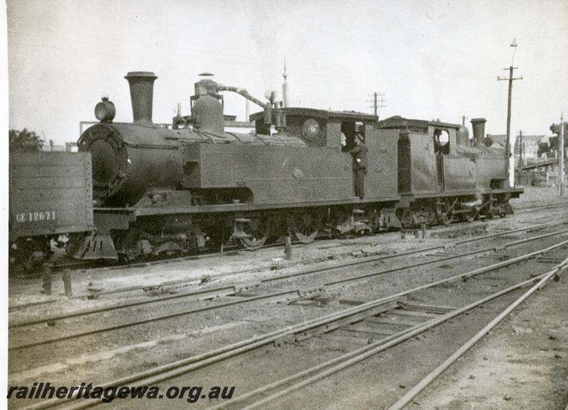 P06137
N class 76 back to back with another N class, East Perth Loco Depot, front and side view
