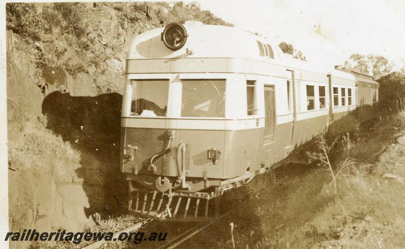 P06339
ADE class, near tunnel, ER line, front and side view, towing an AG class Gilbert car as a trailer.
