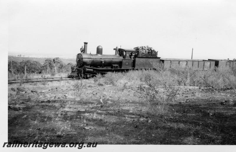 P06586
Millars loco No.58, halfway between Jarrahdale Mill and Mundijong. Jarrahdale line, front and side view, on short goods train, similar to P6574
