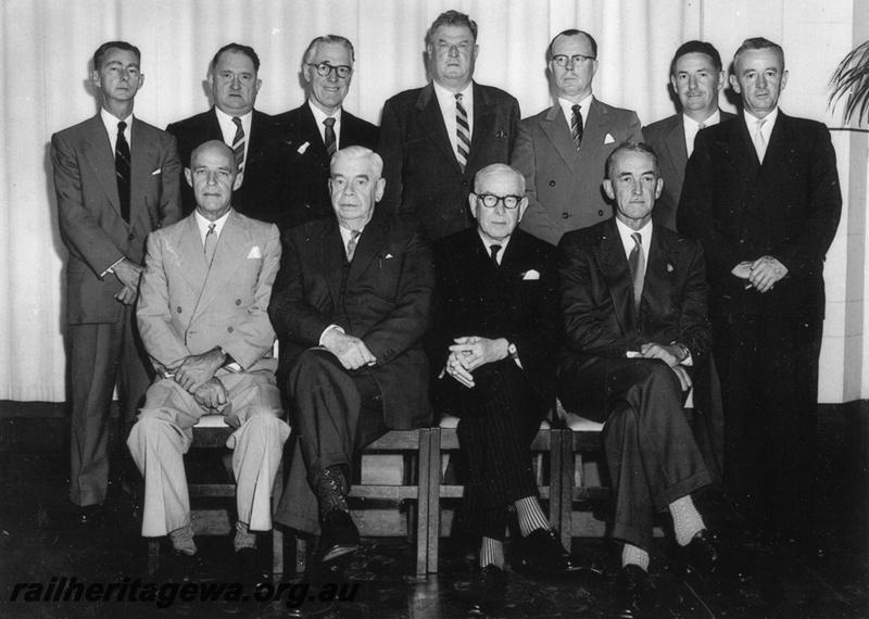 P06774
Group photo of the Executive Officers and Directors  of the MRWA. Rear row , Executive Officers, left to right, F. R. Hall, Accountant, L. m. Priddle, Stores Supt., J. E. Norman, Road Service Superintendent, S. Blockley, Mechanical Engineer, A. H. Amoore, Railway Traffic Superindent, Front row,  Local Board of Directors, W. W.  Holmes, D. W.  Brisbane (Chairman), Sir Ross McDonald, J. B. Dowson (General Manager).
