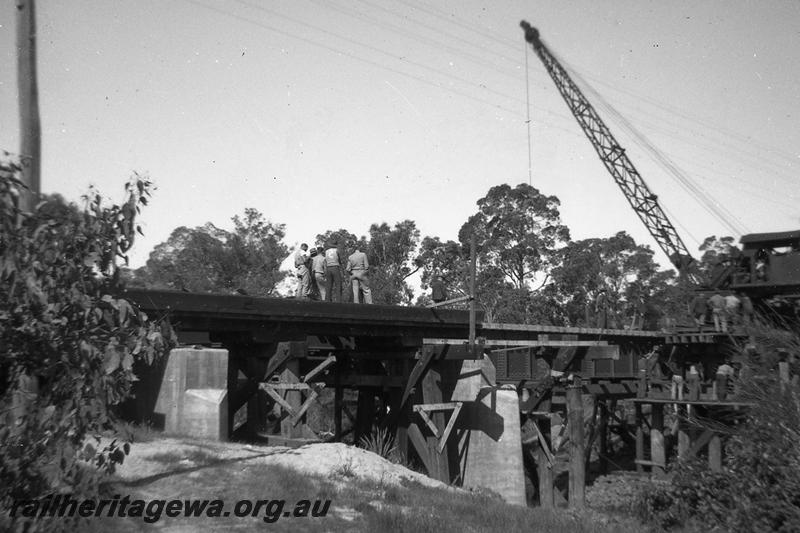 P06907
3 of 6 views of the replacement of the timber trestle bridge over the Serpentine River, just north of Serpentine Station with a steel girder bridge, SWR line.
