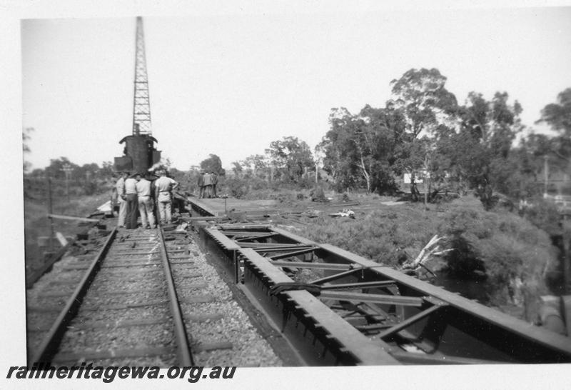 P06908
4 of 6 views of the replacement of the timber trestle bridge over the Serpentine River, just north of Serpentine Station with a steel girder bridge, SWR line.
