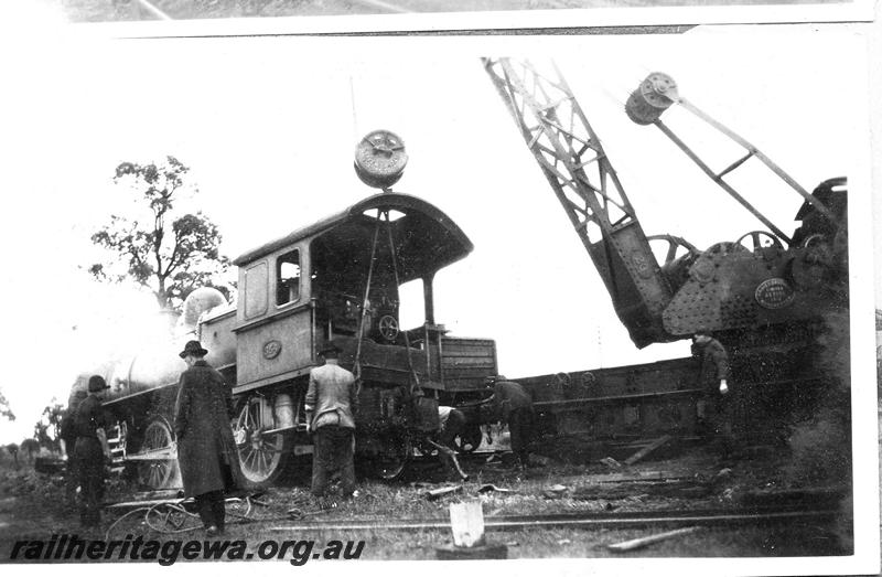 P07066
7 of 8 views of the smash at Wokalup, SWR line, shows steam crane No.23 lifting E class 345, cab end.
