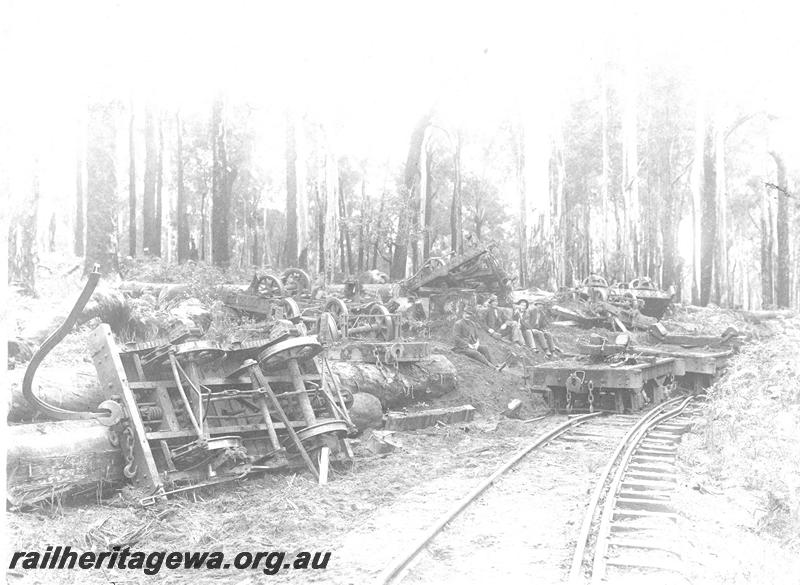 P07100
3 of 5 views of the derailment of SSM loco No.57, Deanmill, view along track showing derailed and overturned wagons
