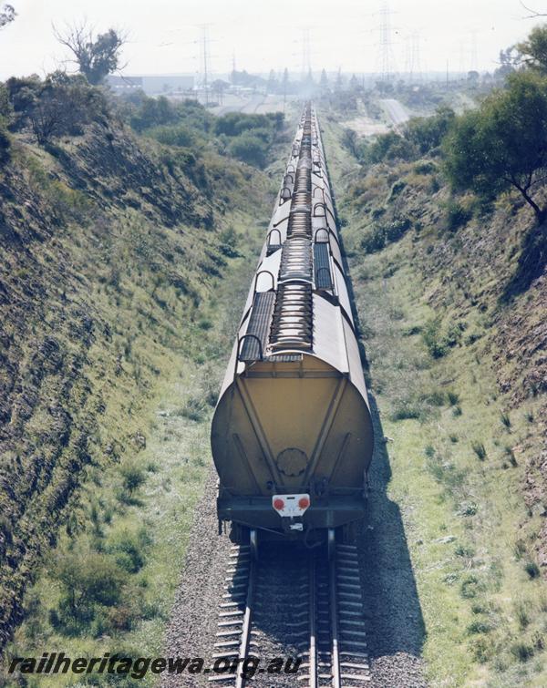 P07193
WW class grain hoppers, Kwinana, elevated view along train, First train out of Kwinana with a two man crew without a brakevan. (ref Railways Institute Magazine, Vol 81, September 1984, page 2), (see also: 