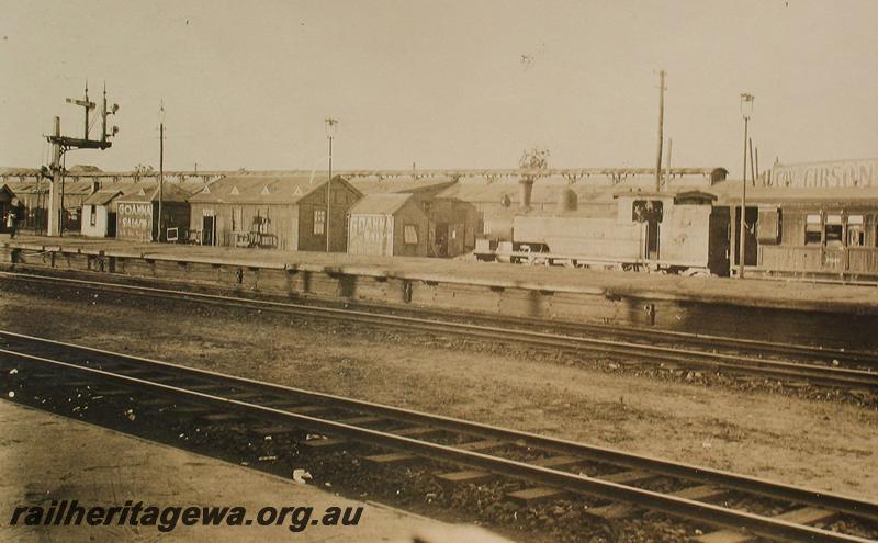 P07229
N class on suburban goods, station platforms, Perth looking north west. Advertisements for 