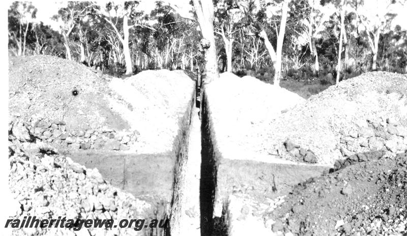 P07307
3 of 32 photos of the construction of the railway dam at Hillman, BN line, pipe outlet trench
