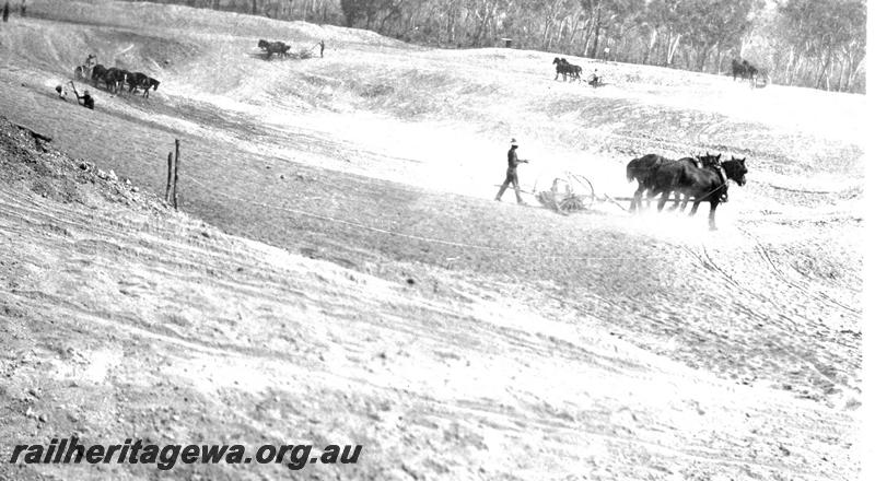 P07314
10 of 32 photos of the construction of the railway dam at Hillman, BN line, excavation in progress with horse drawn scrappers
