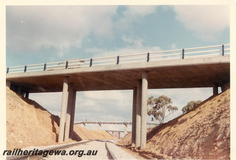 P07371
Road overbridge over standard gauge line beyond Merredin, narrow gauge flyover in background.
