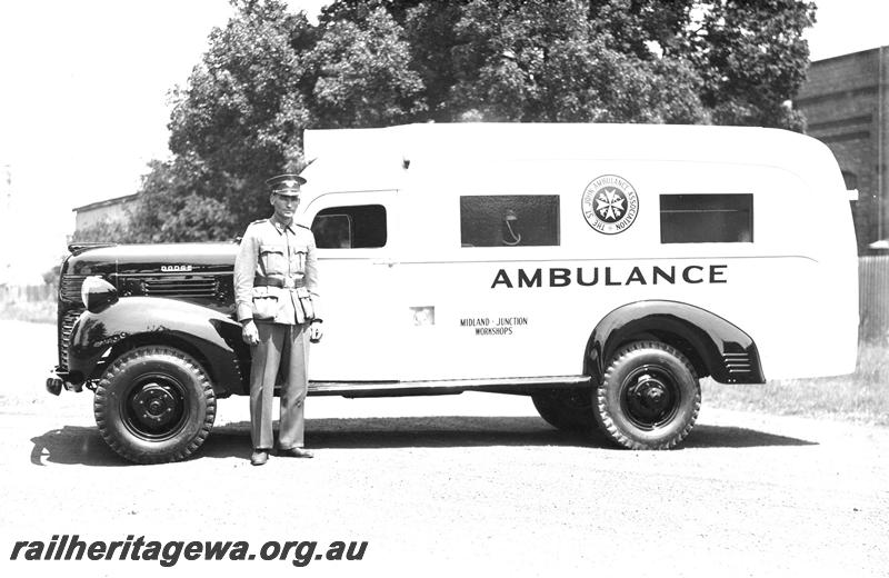 P07397
9 of 9 photos depicting wartime activities at the Midland Workshops, Workshops Dodge ambulance built at the workshops, side view with attendant
