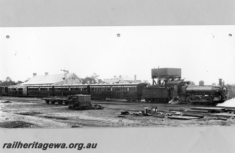 P07536
MRWA C class 18, water tower, station building, Gingin, MR line, on passenger train.
