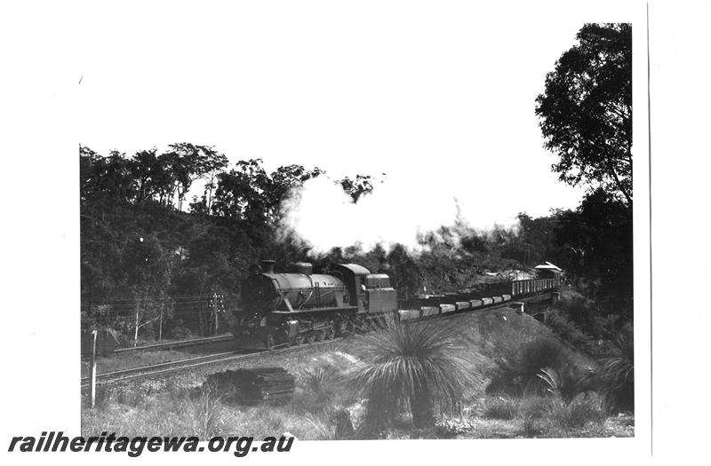 P07642
W class 913, on goods train passing through John Forest National Park, ER line, National Park station building in background.
