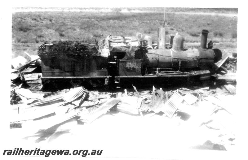 P07718
4 of 8 views of the burnt down running shed at Port Hedland, PM line on 9.10.1950, the night before the annual visit by the Chief Boiler inspector (Jack Farr), accompanied by a fitter (Ted Bosworth) and a boiler maker. G class 234 was badly damaged in the fire. similar view to P7717

