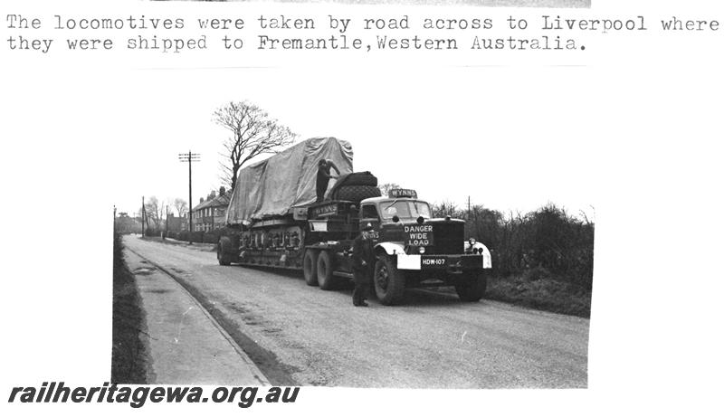 P07740
Y class locomotive, departing Clayton Equipment Co. works, Hatton, UK, being transported to the docks at Liverpool, on semi trailer.
