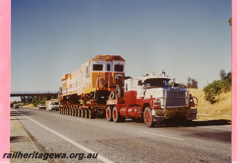 P07842
MT Newman loco No.5506, on low loader, side and front view
