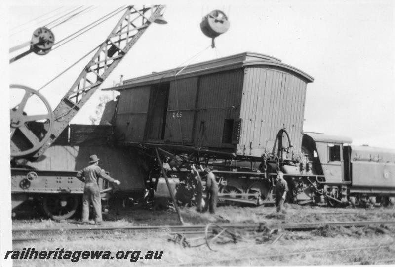 P08135
4 of 7 views of the collision at Yarloop, SWR line, by a train headed by W class 951 and a stationary goods train. Z class 65 clerestory roofed brakevan being lifted by the 25 ton breakdown crane.
