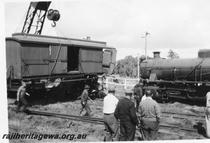 P08138
7 of 7 views of the collision at Yarloop, SWR line, by a train headed by W class 951 and a stationary goods train. shows Z class 65 clerestory roofed brakevan being lifted clear of the track and the front half of W class 951
