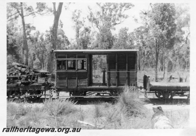 P08190
Millars abandoned brakevan with passenger compartment, coupled to other abandoned rolling stock
