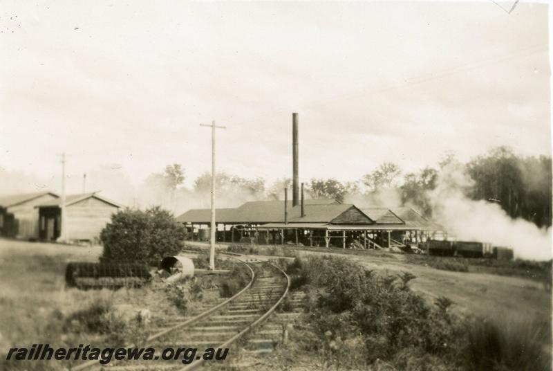 P08212
Timber mill, Quinninup, general view showing track entering site. Further descriptions on rear of photo
