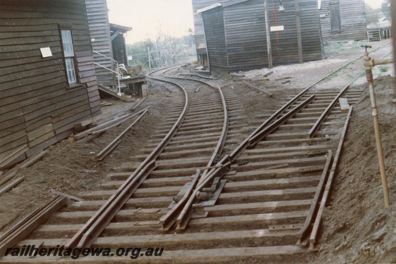 P08268
Trackwork being altered, Yarloop workshops, view along track between the buildings
