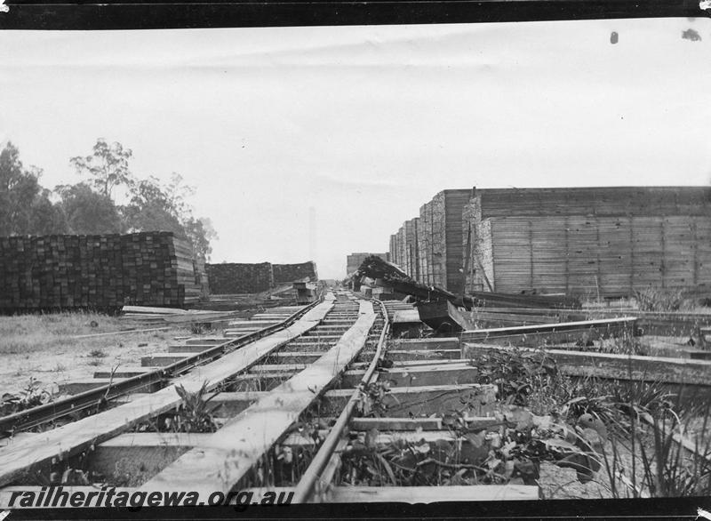 P08314
Timber stacks, Yarloop, seasoning floor boards, track between timber stacks.
