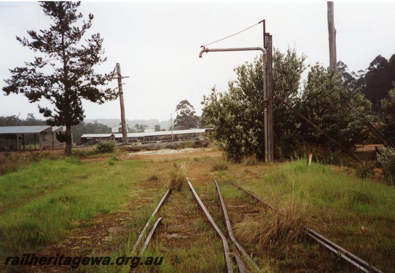 P08374
Water column, overgrown track, Northcliffe, mill in the background
