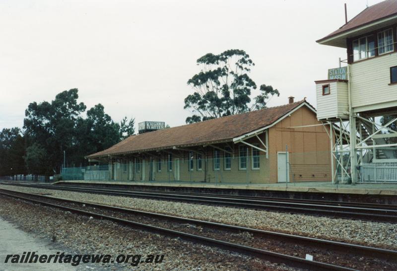 P08449
Merredin, station building, narrow gauge, view from standard gauge, EGR line. Part of signal box, water tower with 