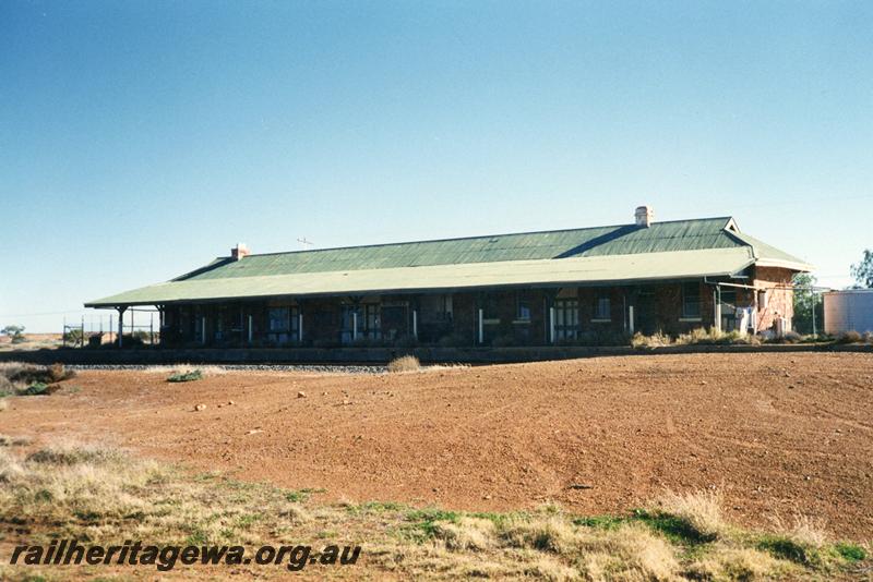 P08551
Masonry (stone) station building, platform, view from rail side, Menzies, KL line.
