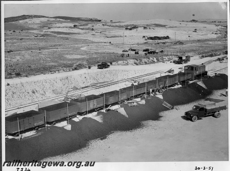 P08686
SEC diesel loco, rake of open wagons, South Fremantle Power station, unloading coal by hand as the tippler not yet in operation, elevated overall view.
