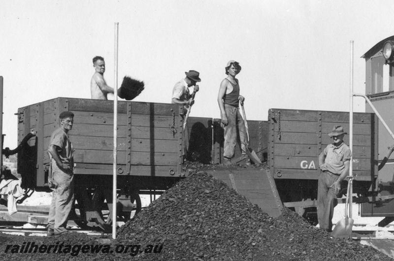 P08688
GA class open wagon, number obscured by worker, end and side view.
