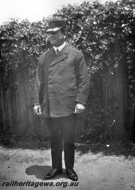 P08695
E. W. Vaughan, in a station master's uniform.
