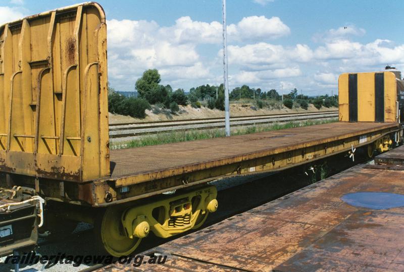 P08941
2 of 3 views of WFEX class 33050-M standard gauge flat wagon with high end bulkheads, end and side view, opposite side to P8940
