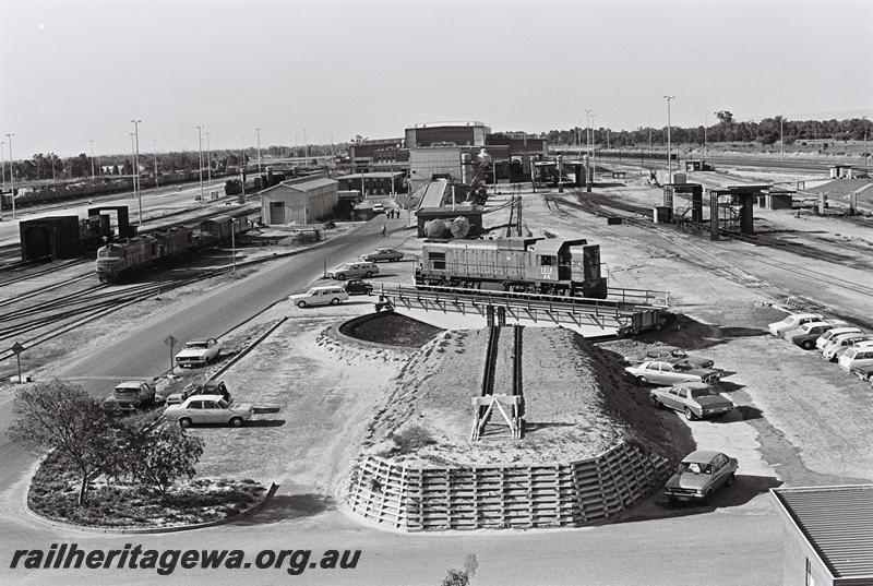 P09044
AA class 1515, on turntable, Forrestfield Yard, being turned, tank from JG class tank wagon in background, elevated overall view 
