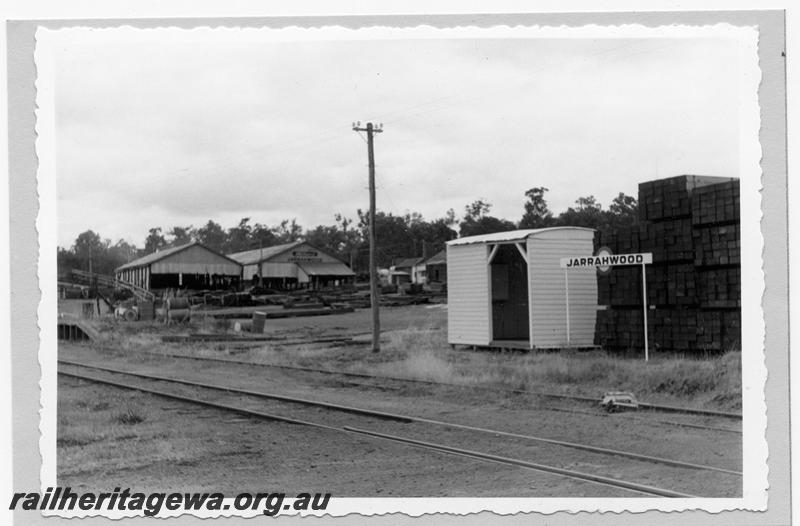 P09357
Jarrahwood, out of shed, nameboard, part of loading ramp, timber mill, timber stacks, derail. WN line.
