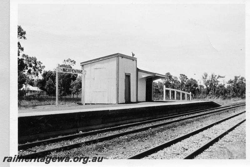 P09392
Serpentine, station buildings, platform, nameboard, view from rail side. SWR line.
