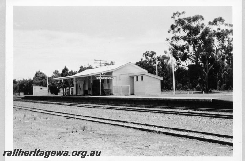 P09405
Station buildings, platform, nameboard, Mundijong, view from rail side. SWR line.
