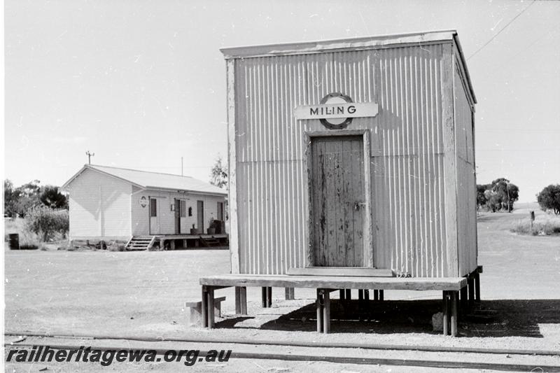 P09490
Miling, shed, nameboard, station building in background. CM line.
