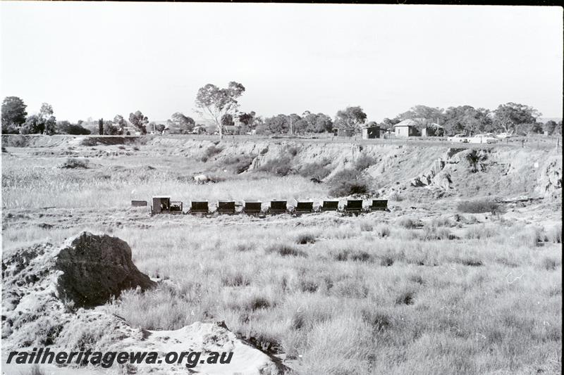 P09541
Locomotive hauling a train of eight hoppers, Maylands Brickyards, side on view of train.
