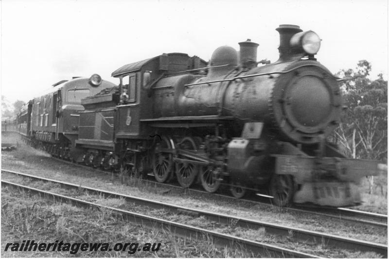 P09567
E class 3__ double heading with a plain green X class on a passenger rain
