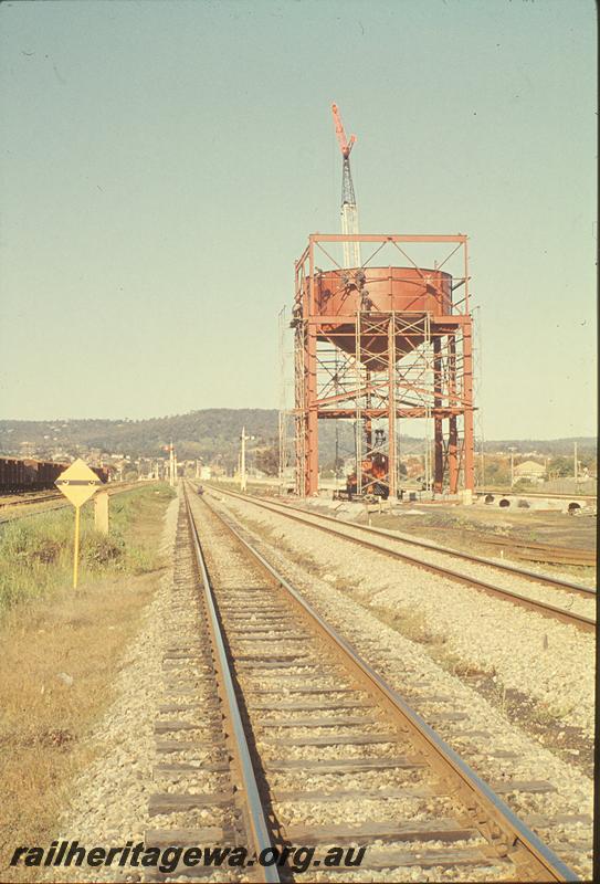 P09796
Grain transfer bin, under construction, part of marshalling yard, old narrow gauge main line, warning board, signals, signal box in distance, between Midland Junction and Bellevue. ER line.
