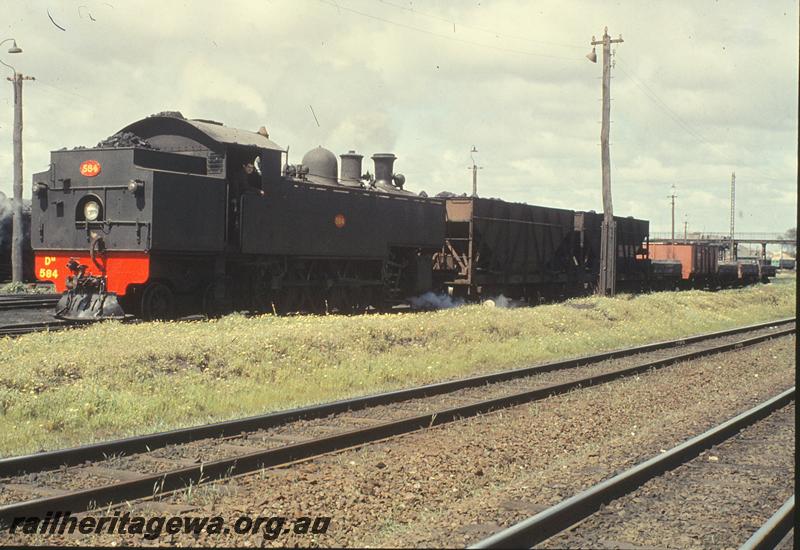 P09831
DM class 584, shunting coal wagons, VI class 7980 Locomotive Instruction Van in background, East Perth loco shed. ER line.
