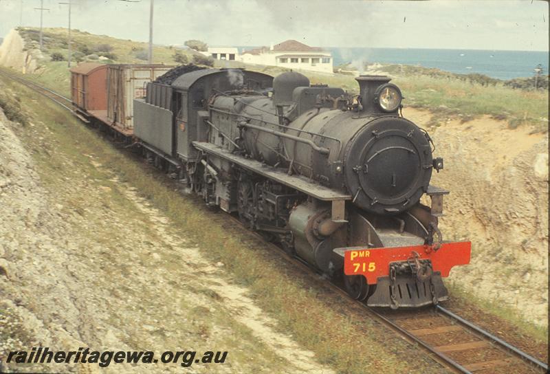 P09848
PMR class 715 on down goods, container on flat wagon, departing Leighton yard. Leighton yard to Cottesloe goods line.
