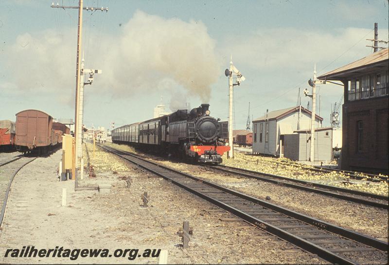 P09852
DD class 591, Down passenger, signals, part of Signal Box A visible, departing Fremantle. ER line.
