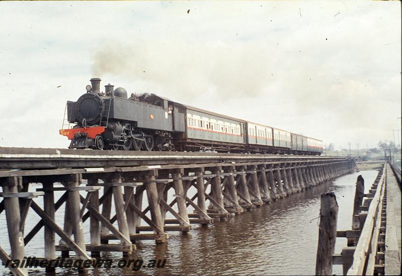 P09862
DD class 597, down show passenger, Bunbury bridge, three different liveries on carriages. SWR line.
