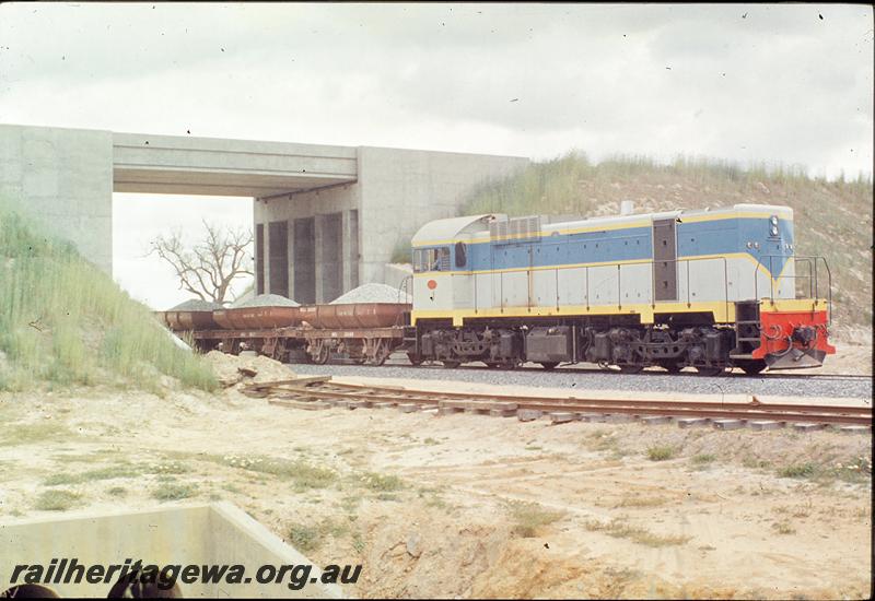 P09865
J class, pushing standard gauge ballast train, under Kenwick Flyover. Forrestfield - Fremantle line.
