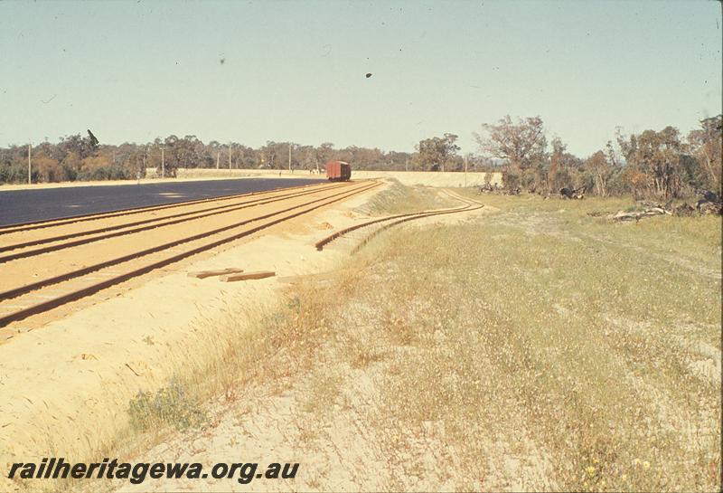 P09880
Bibra Lake, new yard, hard stand for interchange, standard gauge in background, remains of Jandakot branch at side of yard. FA line.
