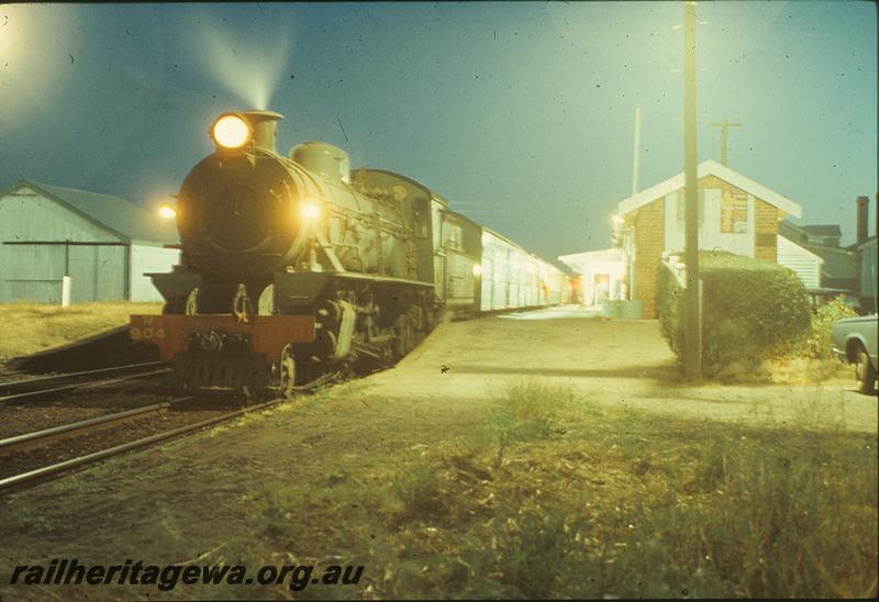 P09951
W class 904, holiday passenger ex Bunbury, station building, platform, goods shed, Pinjarra. Night photo. SWR line.
