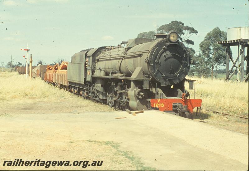 P09953
V class 1215, up goods, signals, water column, platform, water tower, entering Brunswick Junction. SWR line.
