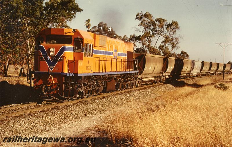 P10002
N class 1873, hauling empty XC class bauxite wagons approaching Wellard on its first revenue service.
